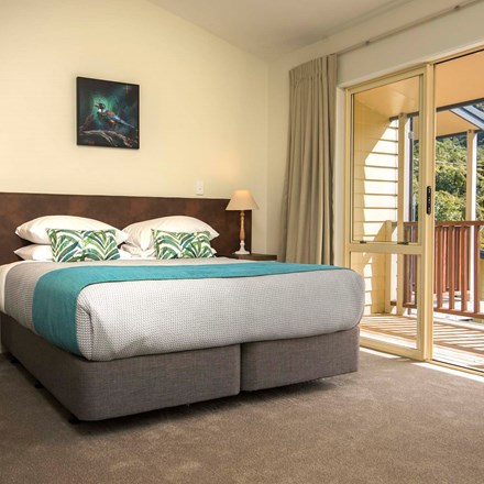 Fern Studio accommodation rooms have a spacious bedroom area and private balcony to enjoy scenic views at Punga Cove in the Marlborough Sounds in New Zealand's top of the South Island