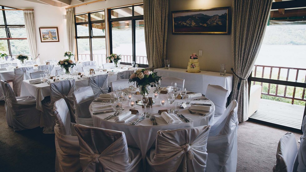 Wedding reception dining at the Punga Fern Restaurant can be indoor or outdoor with seating available for each preference and surrounding views of Punga Cove and Endeavour Inlet in the Marlborough Sounds of New Zealand