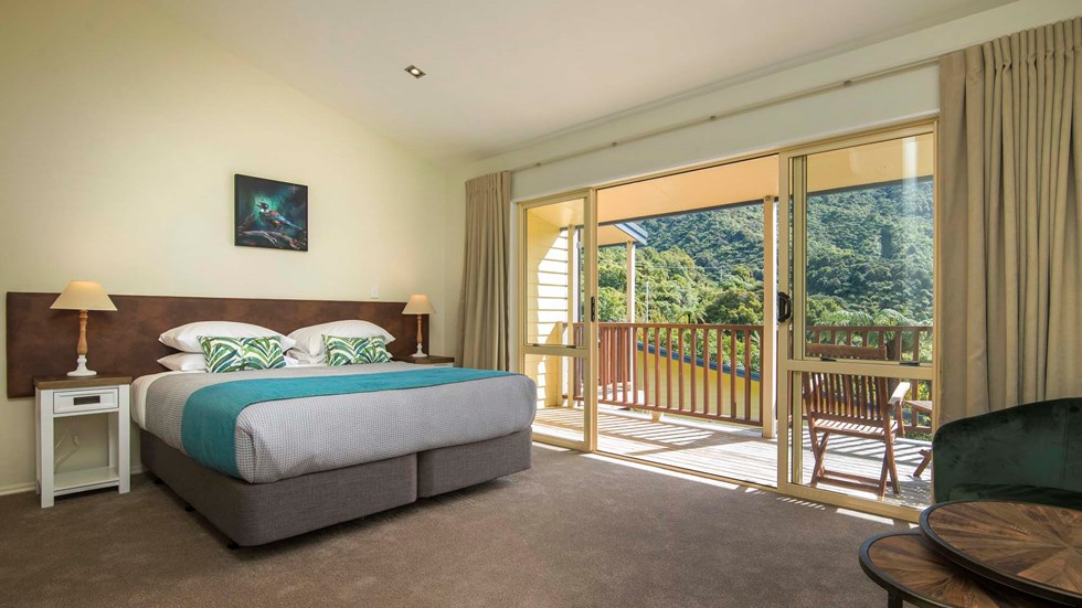 Fern Studios include a spacious bedroom area with a private balcony for relaxing and enjoying scenic Endeavour Inlet views at Punga Cove in the Marlborough Sounds of New Zealand