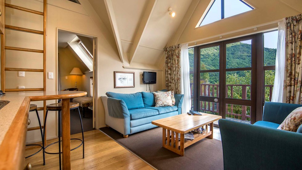 Mamaku Apartment accommodation rooms have a spacious lounge area with sofas and seating at Punga Cove in the Marlborough Sounds in New Zealand's top of the South Island