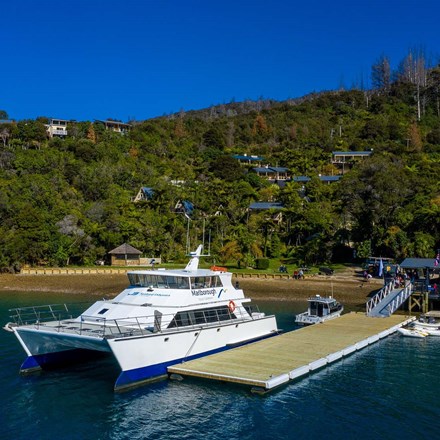 Large commercial vessel can park easily at Punga Cove's jetty located at the bottom of the accommodation property in the Marlborough Sounds in New Zealand's top of the South Island