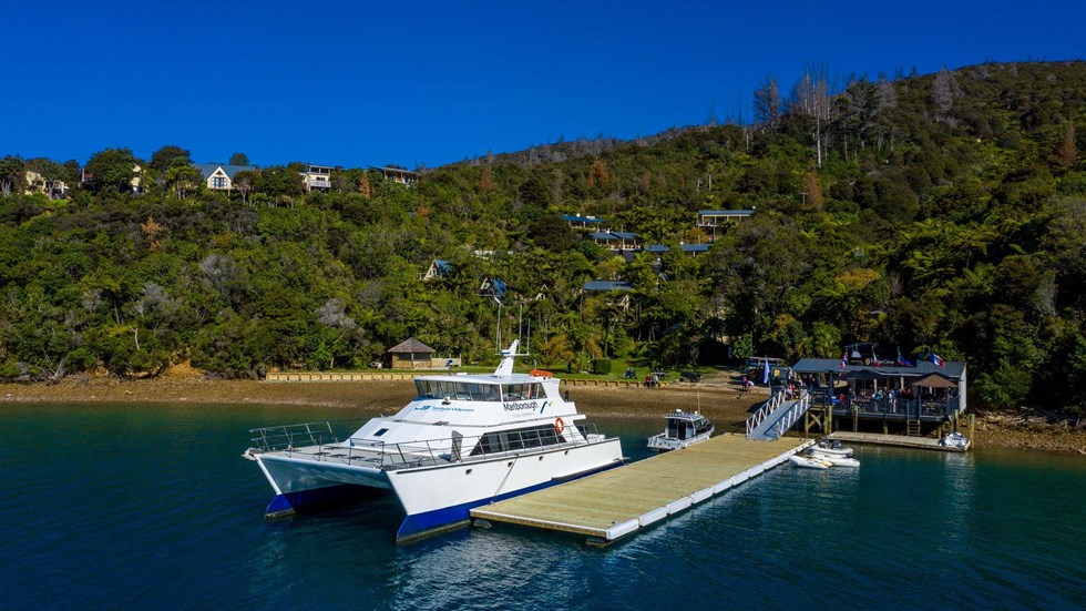 Large commercial vessel can park easily at Punga Cove's jetty located at the bottom of the accommodation property in the Marlborough Sounds in New Zealand's top of the South Island