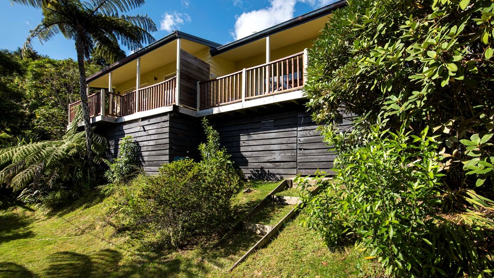 Frond Suite accommodation rooms are surrounded by lush green native bush and have a private balcony at Punga Cove in the Marlborough Sounds in New Zealand's top of the South Island