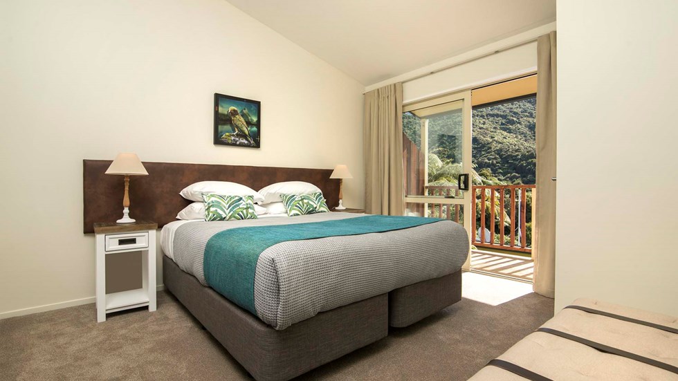 Frond Suites include a spacious bedroom area with a King bed and private balcony for relaxing and enjoying scenic Endeavour Inlet views at Punga Cove in the Marlborough Sounds of New Zealand