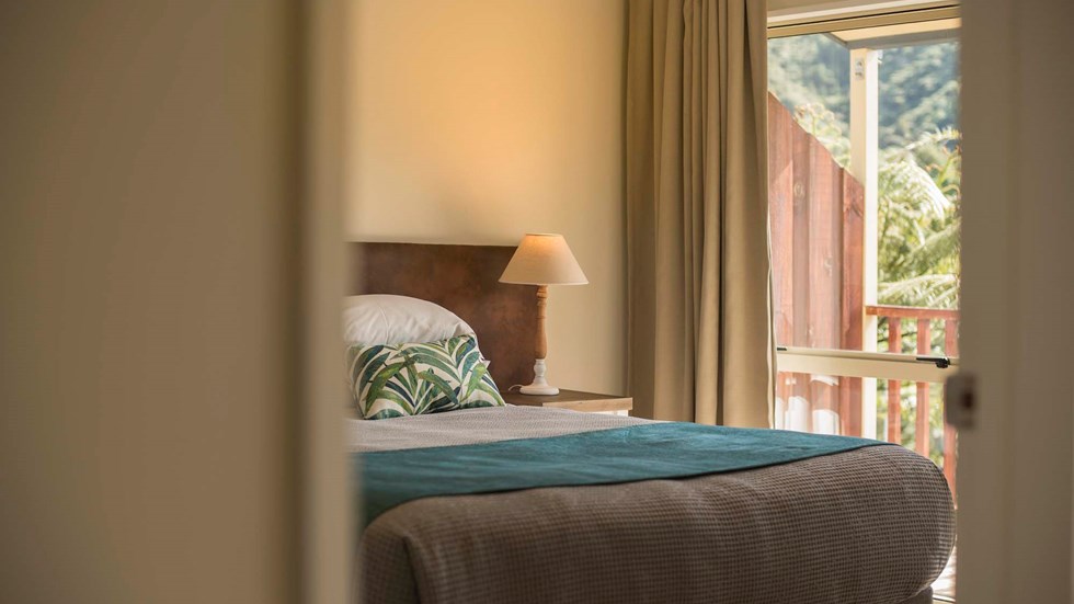 Enjoy beautiful bedroom details reflecting the natural surroundings in Frond Suites at Punga Cove the Marlborough Sounds in New Zealand's top of the South Island