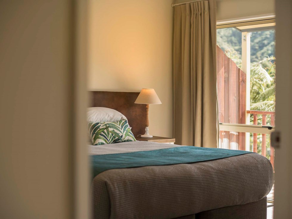 Enjoy beautiful bedroom details reflecting the natural surroundings in Frond Suites at Punga Cove the Marlborough Sounds in New Zealand's top of the South Island